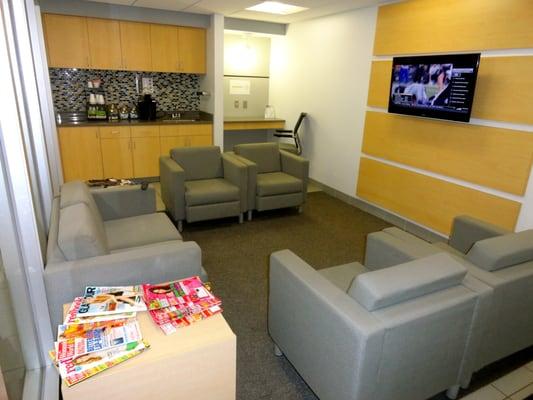 Get comfortable in our waiting room! Free WiFi, Coffee, a workstation, magazines, and the remote is all yours!