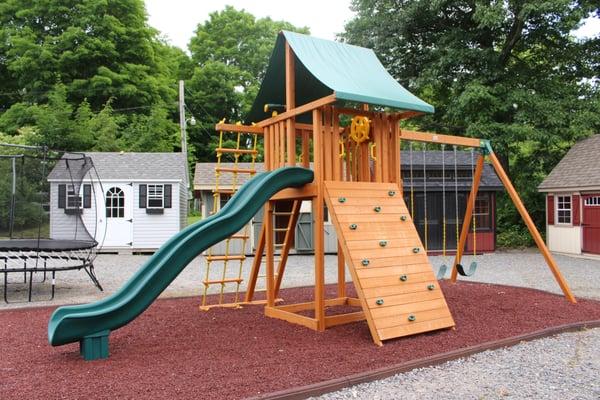 The Ultimate Cedar Swing Set (by Eastern Jungle Gym) on display at Best in Backyards in Danbury, CT.