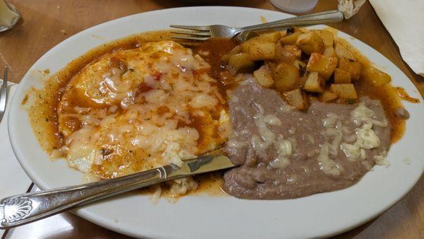 Huevos rancheros with potatoes and beans