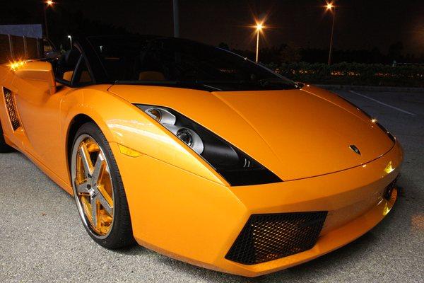 Custom lighting package on an orange Ferrari