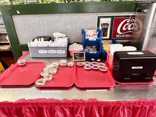 Ketchup, pickles, hot sauce counter