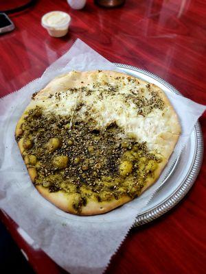 Half cheese half zaatar manakeesh (flatbread)