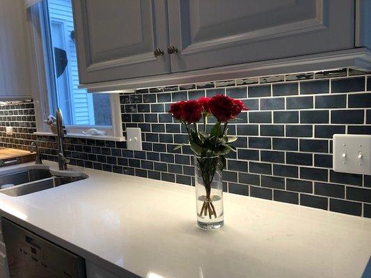 Blue Subway Tile backsplash and Frosty Carina White/Grey  Quartz Countertops