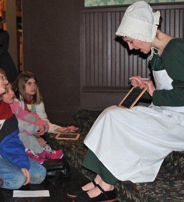 Museum theatre students present historical interpretive programs to children.