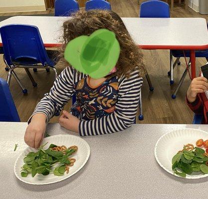 actually reaching for spinach leaves at snack time!