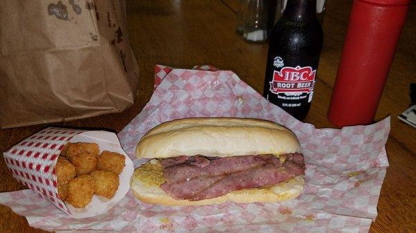 Polish sausage is sliced thin & served on a hoagie roll