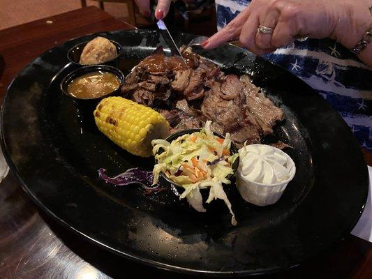 Brisket, corn on the cob, cole slaw, cornbread