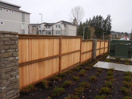 Solid board wood fence with 3 rails and top cap