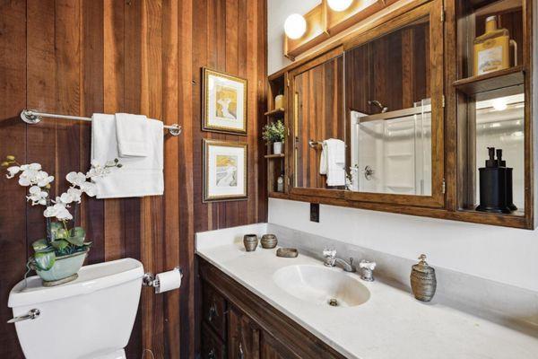 Wood look bathroom showed nicely after Pam staged it.