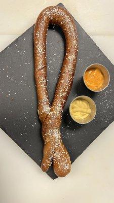 Big Twisted pretzel with nacho cheese sauce and honey mustard. Served warm.