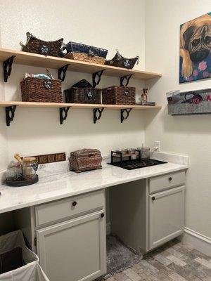 Pet area in utility room. We even cut a hole in bottom cabinet side for hidden litter box!