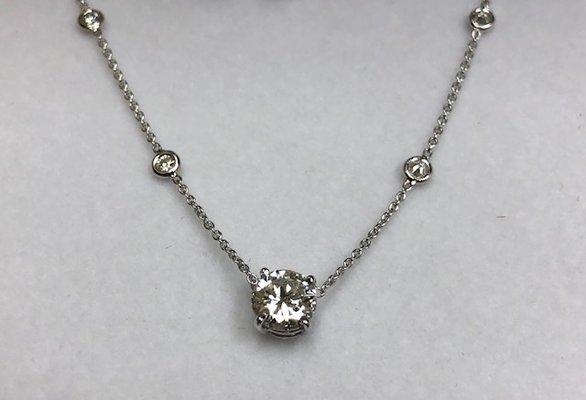 Brilliant diamond pendant with diamonds by the yard attachment.