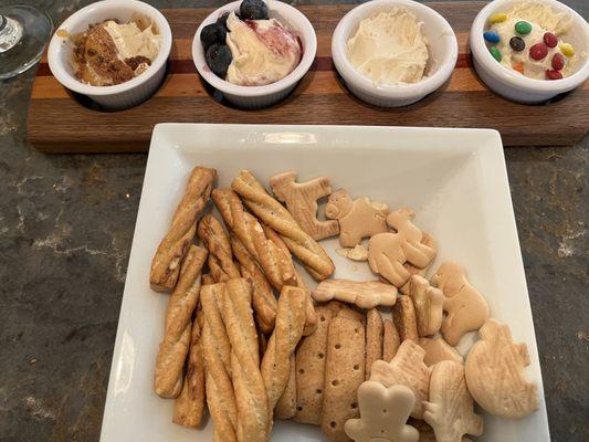 The cheesecake flight is large enough to enjoy or share with a few others. It comes with a variety of crackers and pretzels for dipping.