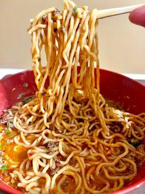 Tan tan ramen - spicy - tonkotsu broth, spicy ground pork, ramen noodles sesame seeds, bok Choy and scallions