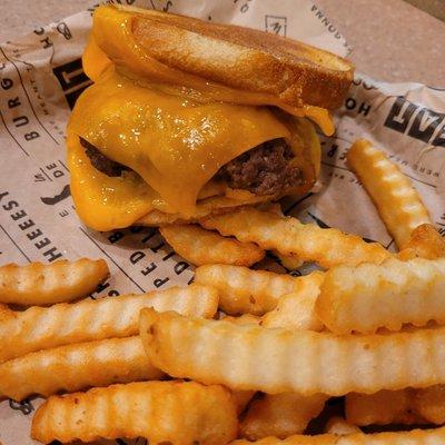 Cheesy burger with fries