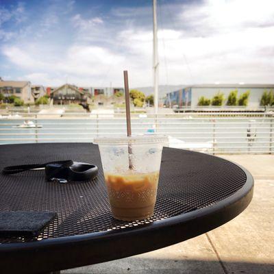 Iced soy latte (and much plastic) beside the beautiful Oakland Estuary