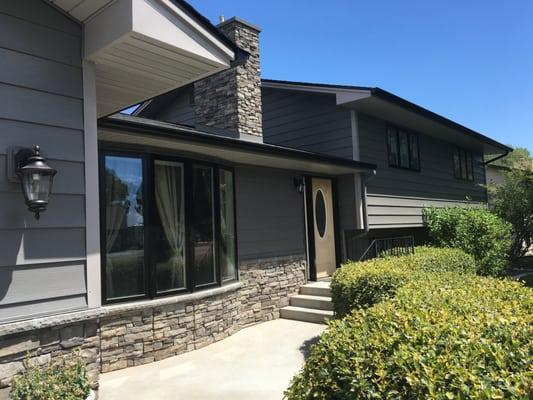 Charcoal Gray Steel Siding and cultured stone