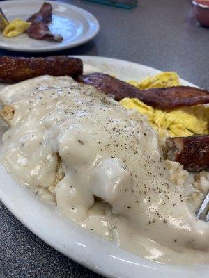 Biscuits and gravy . Mmmmmm home made biscuits .