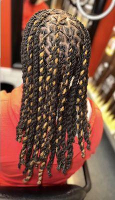 Another locs retwist offered by Nyeisha at Essentially Beau.