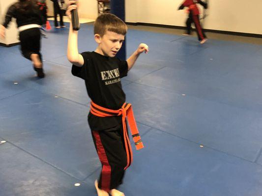 Black Belt Champion kids class Nun Chuck training ( ages 7 1/2 to 13 ).