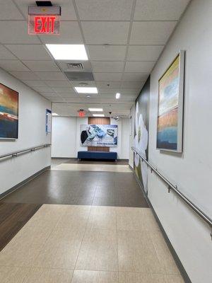 One of the hallways on the first floor on the way to the cafeteria with a ramp