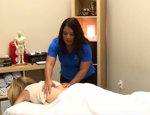 Randolph Pain Relief & Wellness acupuncturist provides pain relief to a patient.