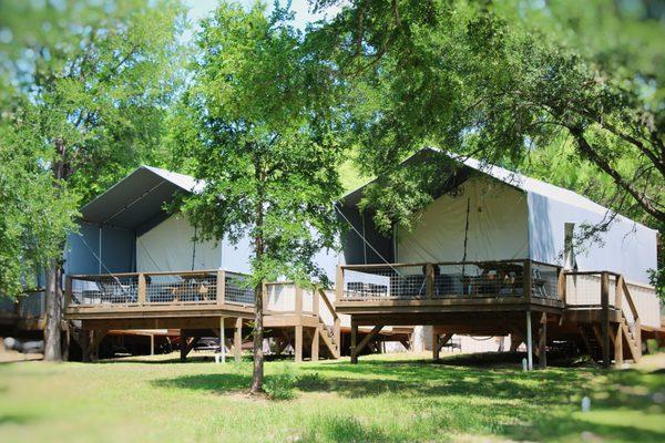 View of our back porch. Each cabin has a picnic table, BBQ pit, firepit, wicker furniture and picnic table.