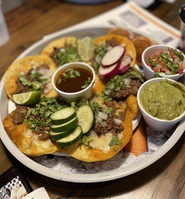 Los Primos Platter - six birria tacos with guac, pico, and dipping sauce. Perfect for sharing!