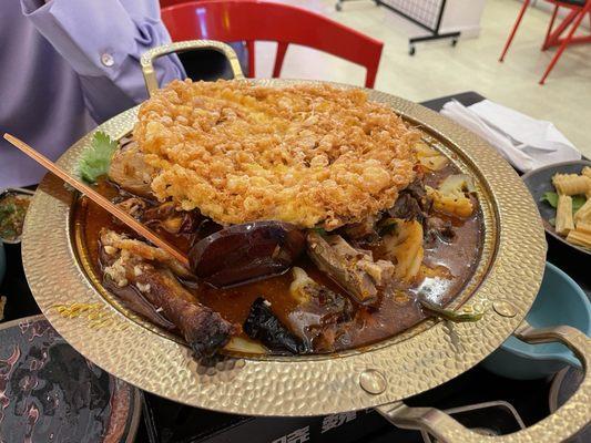 Chengdu Roast Duck Pot topped with Large Fried Eggs