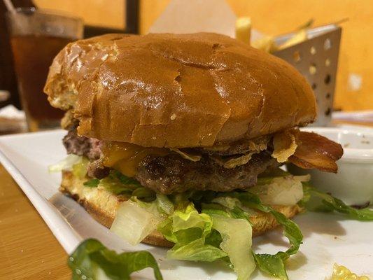 Texas Burger with bacon, onion rings, cheese. Comes with fries.