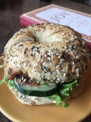 Veggie bagel sandwich with hummus instead of cream cheese