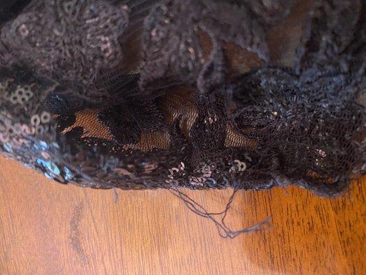 Though hard to see this is a lace seam they left unraveled