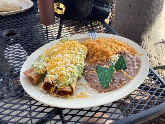 Rolled tacos, rice and beans.