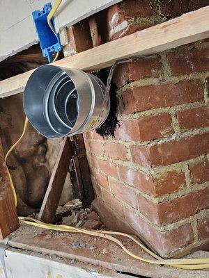 Remodeling converting a chimney into a kitchen fan