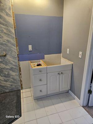 Need a new Cabinrttes in Navy color with Counter, & Mirror, Lighting.