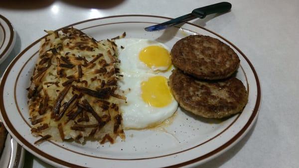 Pathetic looking eggs, dry looking sausage and over cooked hash browns.