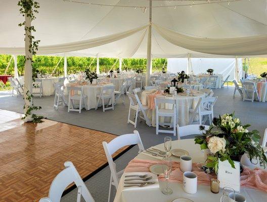 Resin chairs padded with 60inch round tables.