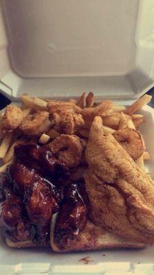 Triple Combo includes 1 Catfish Filet, 6 Wingz(flavor of your choice), 7 Shrimp, Bread, Fries, & a Drink! Located @ 1817 University Ave!