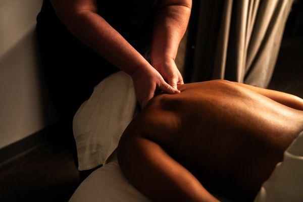 Pam is seen giving a client a deep tissue massage designed to give clients relief from pain and discomfort.