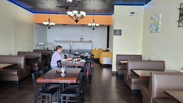 The dining area has booths and tables.