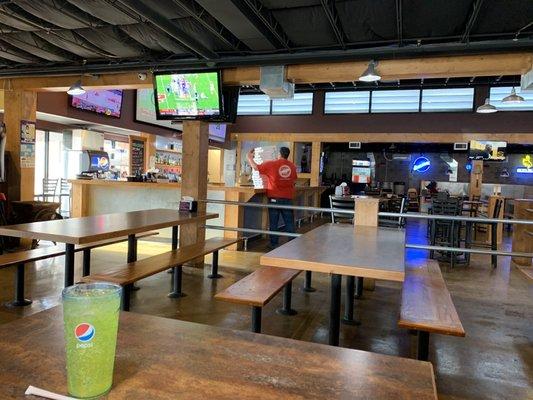 We sat in a booth near the arcade games, looking towards the bar.