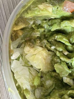 Guacamole dip - bottom layer of shredded lettuce (weird)