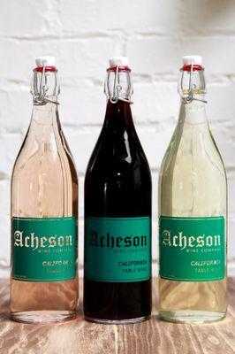 3 Acheson bottles with rose, red and white wine