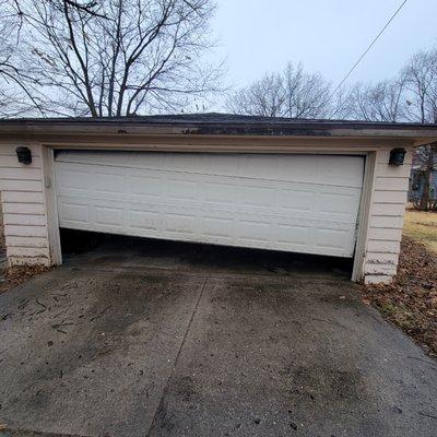 Door out of tracks/ broken cables.