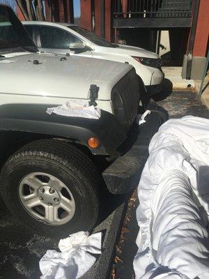 Dirty towels and sheets on my jeep and the ground!