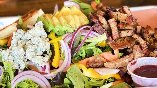 Santa Maria Salad - 1/2 lb of grilled tri-tip with fresh greens, avocado, tomatoes, onion, bell pepper, bleu cheese and garlic bread