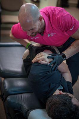 Dr. Ackerman performing a gentle, lower back adjustment