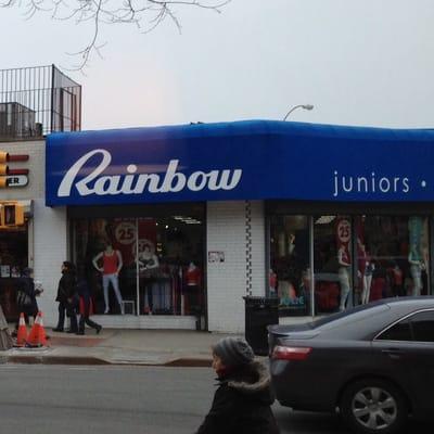 Yes, a store named "Rainbow" has a blue awning!