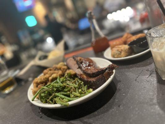 Pork sampler with pull pork, brisket, and chopped pork. Green beans and fried okra! Delicious!