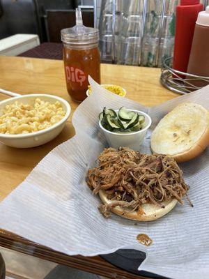 Pulled BBQ sandwich, house made pickles, (perfect!) coleslaw, pepper vinegar (a MUST), Mac and cheese.